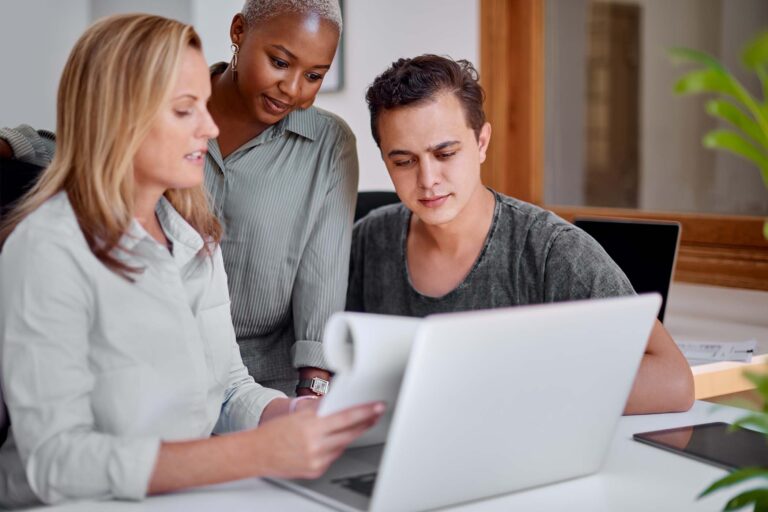 shot-of-a-group-of-businesspeople-working-together-VMGYE8G